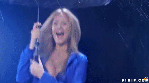 少女雨中撑伞兴奋叫喊图片:下雨,兴奋,雨伞