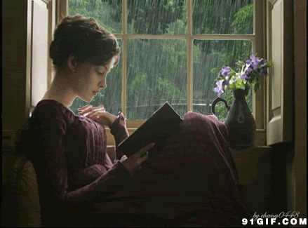 优雅少妇雨天窗前看书图片