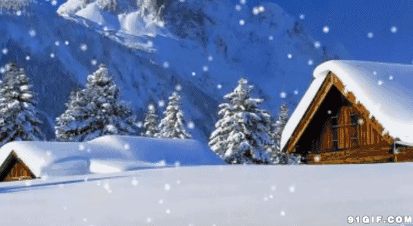 雪山下小屋铺满冰雪图片