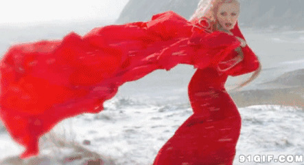 海边舞动红色长裙图片