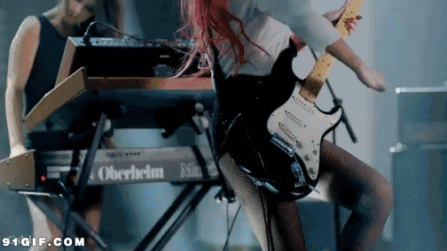 女子吉他手舞台激情图片