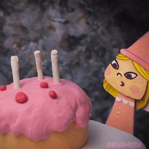 小女孩吹蜡烛卡通图片:生日蛋糕