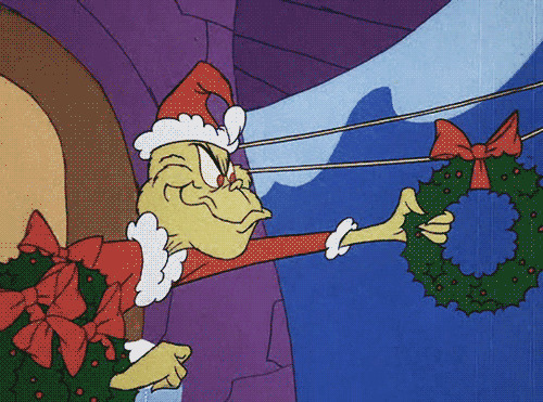 卡通圣诞老人取花环GIF图片