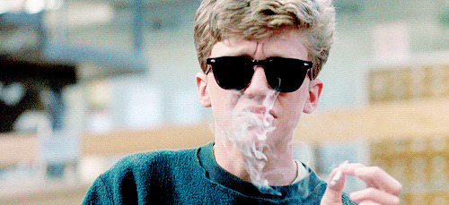 戴墨镜的小男孩学抽抽烟动态图片:抽烟