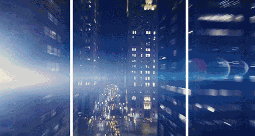 超人在城市的高楼之间自由穿梭gif图片:超人