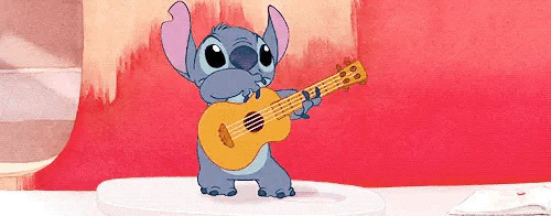 卡通小老鼠在舞台上弹吉他GIF图片:小老鼠