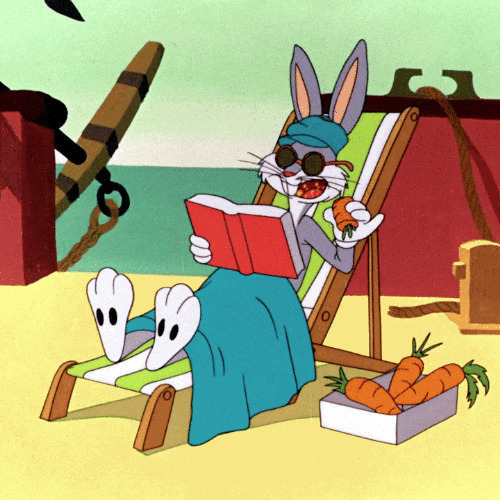 潇洒的兔八哥躺在海边吃萝卜看书GIF图片